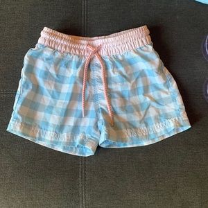 Pale blue gingham and pink swim trunks